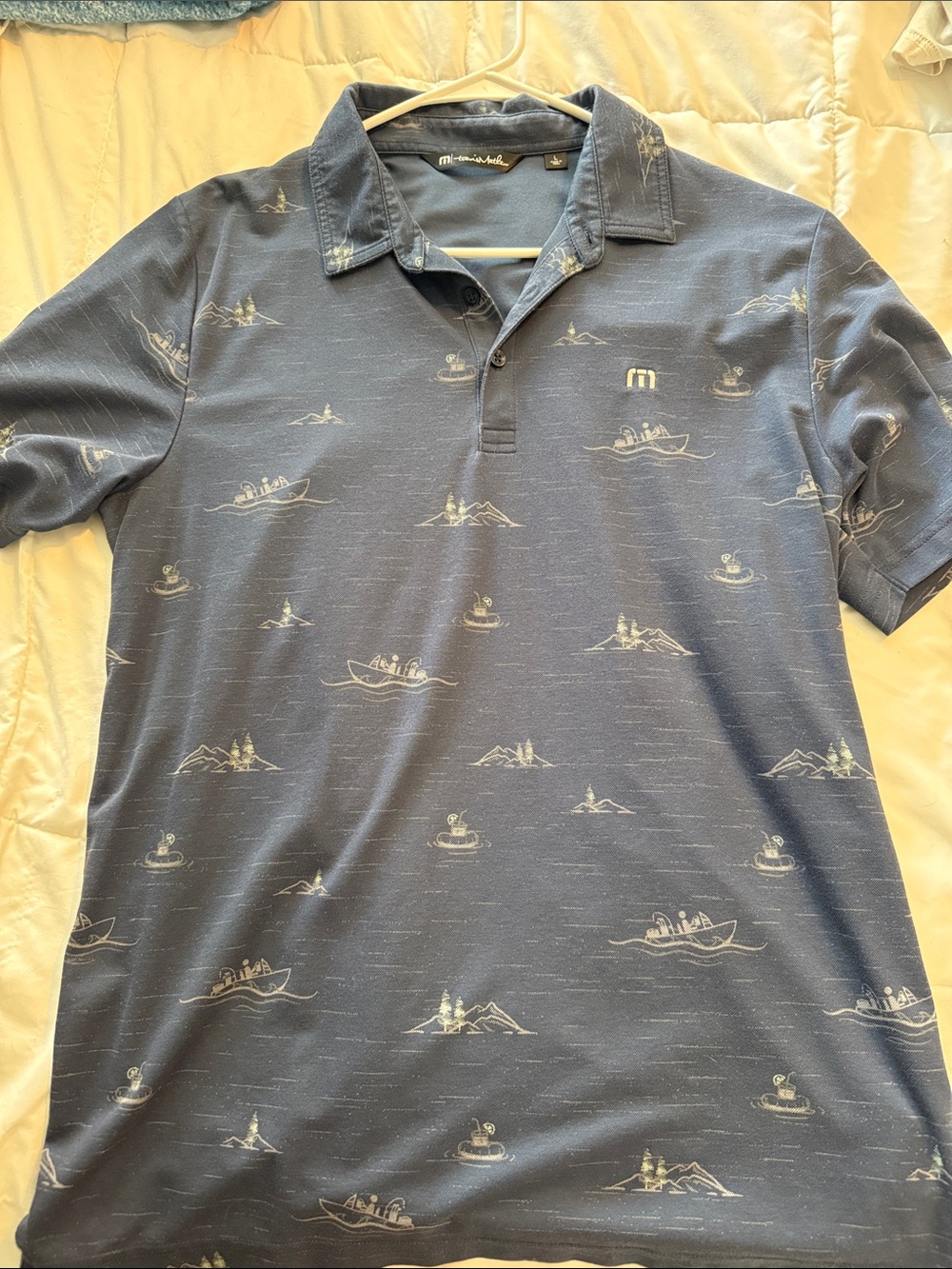 Travis Mathew Blue Polo with White Nautical Motif